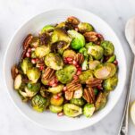 A serving bowl with roasted brussels sprouts.