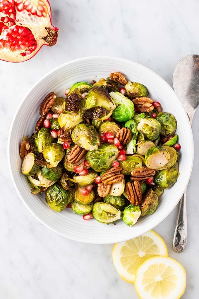 A serving bowl of crispy roasted brussels sprouts.