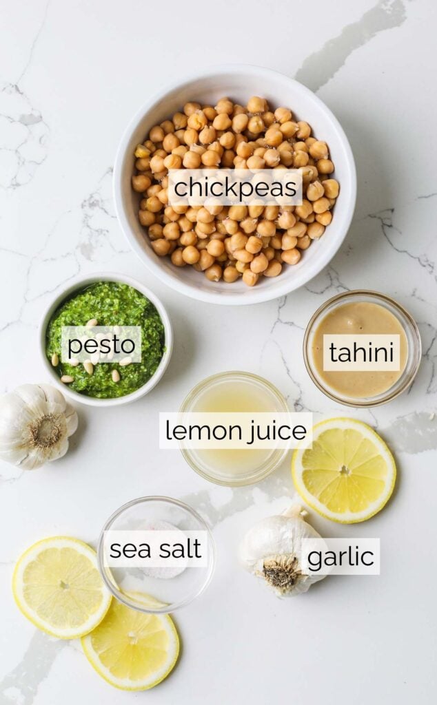 The ingredients needed to make a basil pesto hummus.