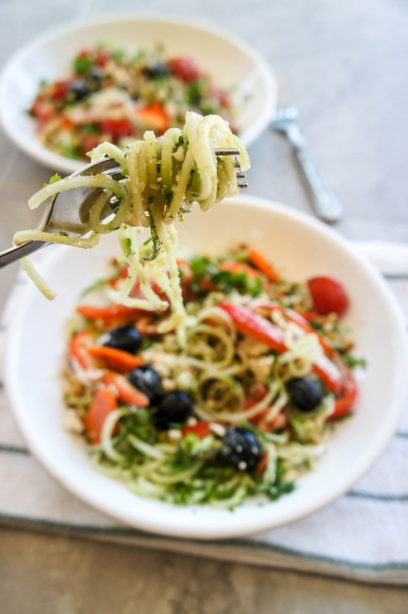 Refreshingly Light Raw Pasta Primavera / This salad masquerades as a noodle dish! Made light and grain free with cucumber "noodles."