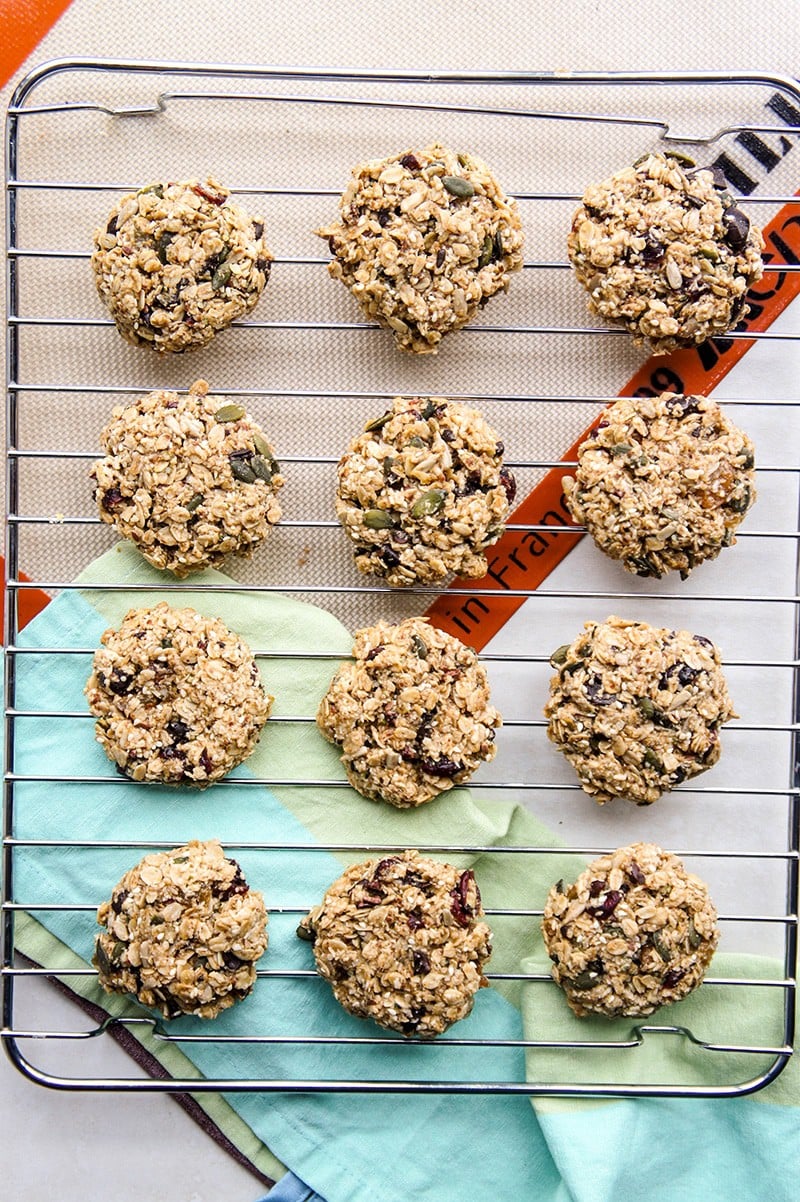 A cooling rack covered with chewy granola cookies.