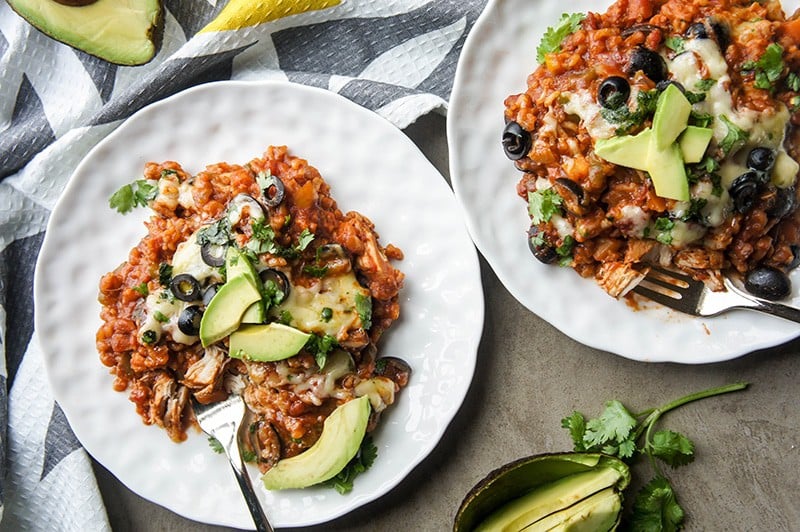 Mexican Chicken and Rice / This slow cooker chicken and brown rice recipe is packed with fiber thanks to tons of veggies. The perfect make-ahead family meal.