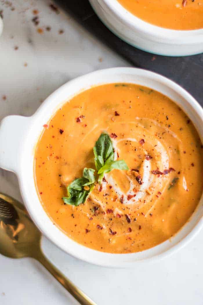 A close up of a bowl of tomato basil Whole30 soup.