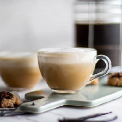 Two clear mugs with a vegan almond latte.