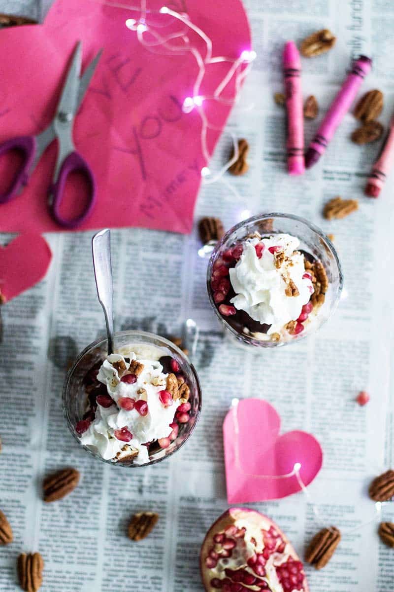 Two sundaes on a newspaper with homemade Valentines cards.