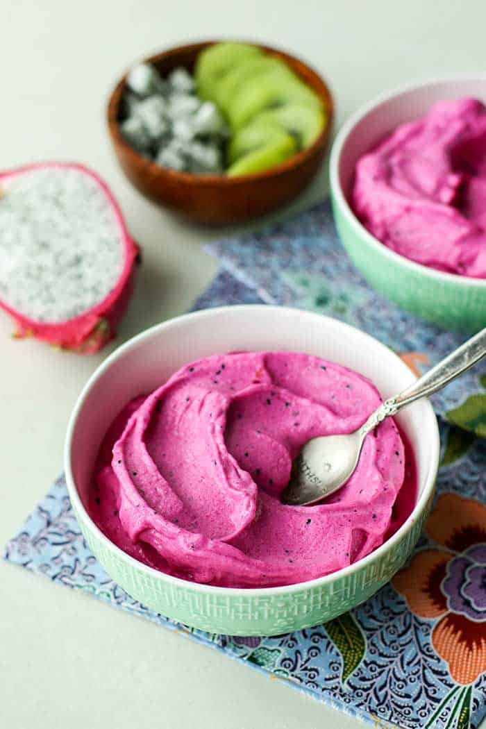 The consistency of this pitaya bowl smoothie is similar to soft serve ice cream, made from frozen dragon fruit, mango, and bananas.