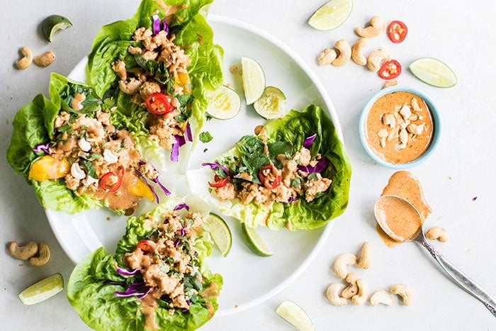 Thai Chicken Lettuce Wraps / These are a flavor explosion! Ginger, chili, and Thai basil make these are super delicious, healthy meal. Paleo and Whole30 compliant.