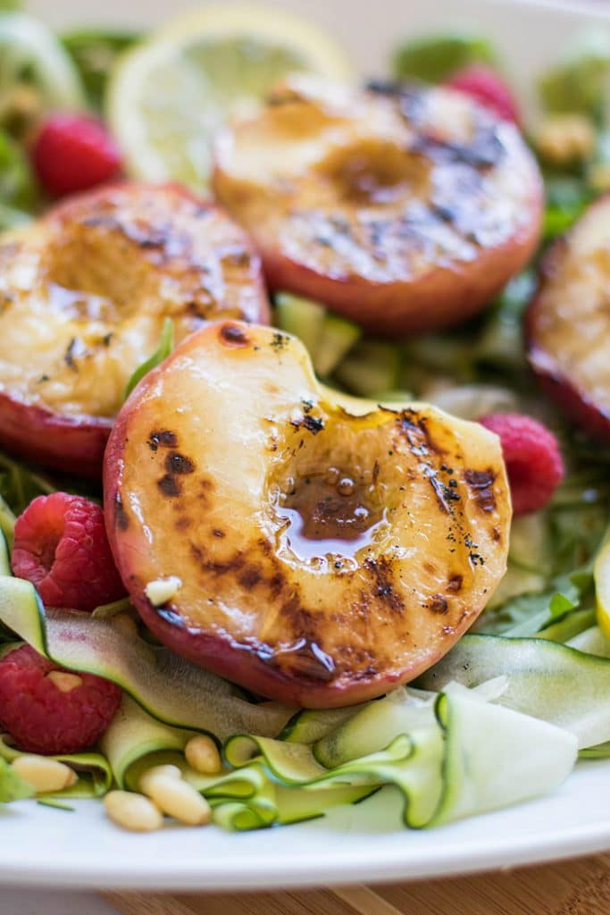 Serrano Honey Grilled Peaches / This simple summer salad is made with sweet grilled peaches and topped with a sweet and spicy vinaigrette.