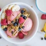 Healthy Breakfast Sundaes - ice cream scoops made of a banana, yogurt and raspberry "nice cream", topping with granola, fruit and nut butter.