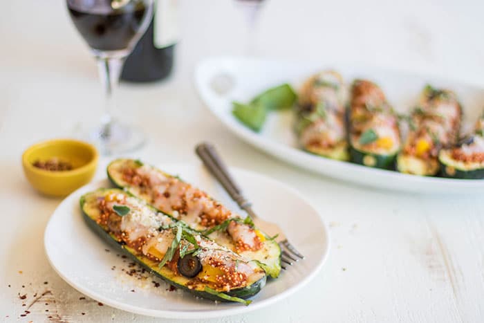 Pizza Zucchini Boats / Have fun with a vegetarian entree on the BBQ this summer. Zucchini is stuffed with a 1-pan quinoa pizza recipe.