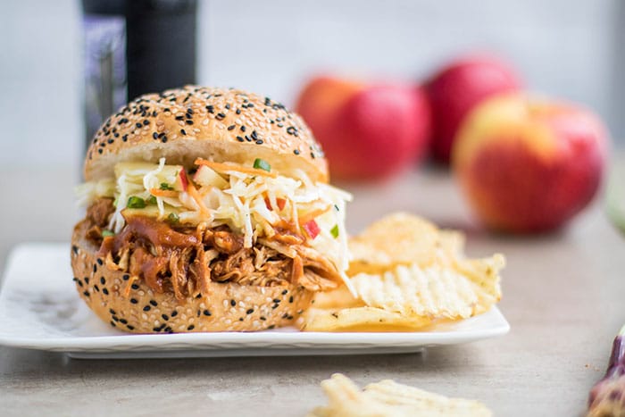 Apple BBQ Pulled Chicken Sandwich / This delicious sandwich is made with a low sugar apple BBQ sauce, and topped with a tangy apple slaw.
