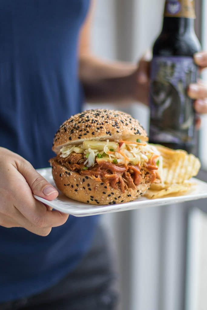 BBQ Pulled Chicken Sandwich / This delicious sandwich is made with a low sugar apple BBQ sauce, and topped with a tangy apple slaw.