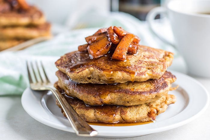 Thick butternut squash pancakes make with oat flour and eggs.