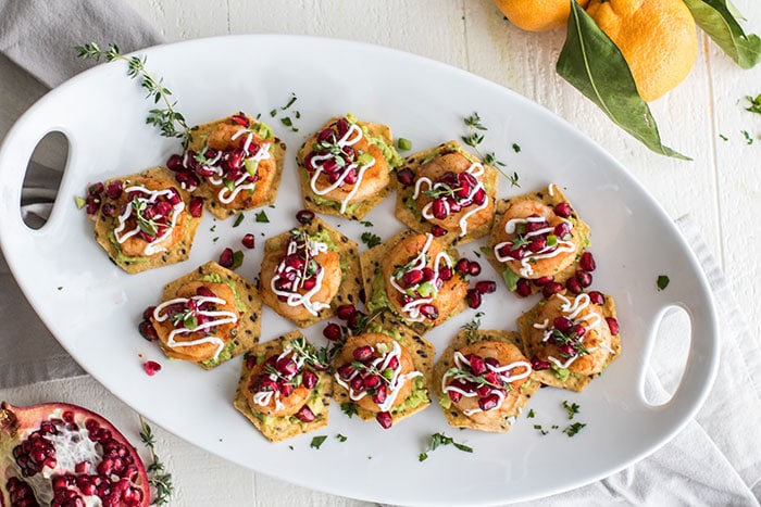 Blackened Shrimp Tostadas with Pomegranate Guacamole / The perfect healthy party appetizer! Blackened shrimp, guacamole, and a tangy pomegranate salsa.