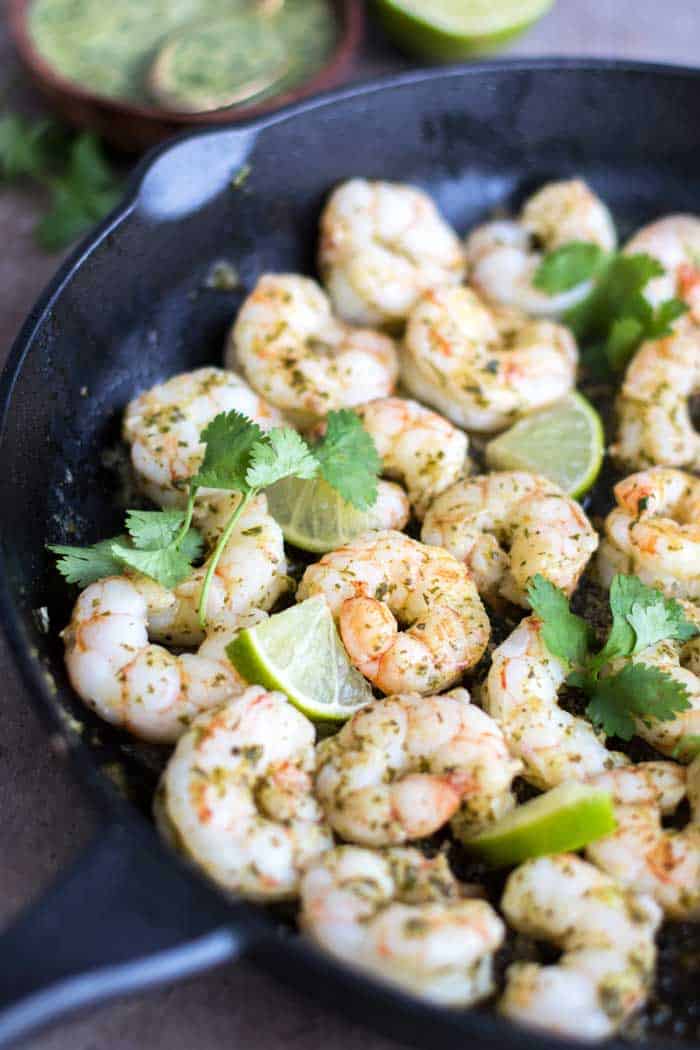 A pan of shrimp marinated in cilantro lime marinade.