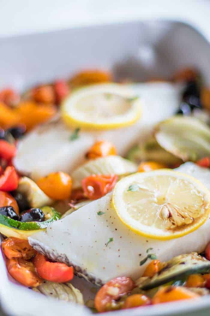 Mediterranean baked vegetables with two cod fillets.