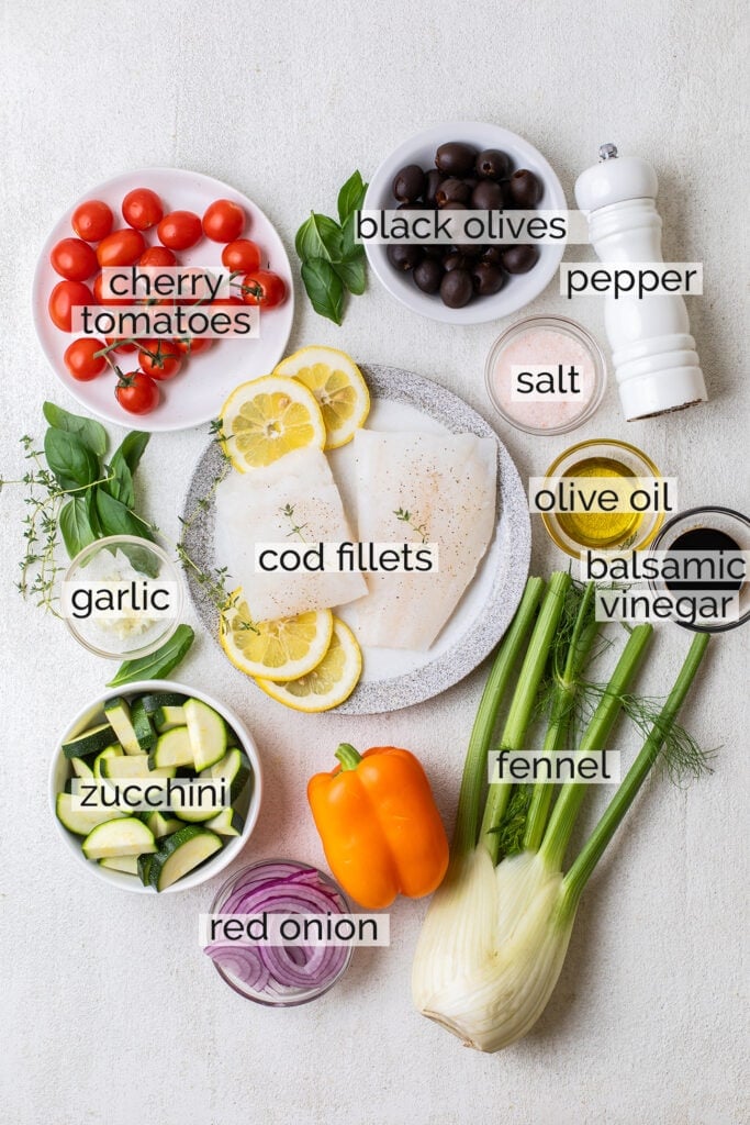The ingredients needed to make mediterranean cod shown with labels.