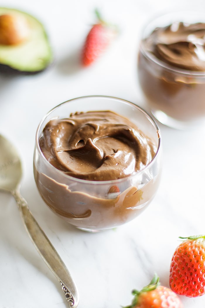 Two clear glasses of hidden greens chocolate pudding.