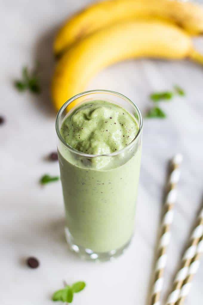 A thick green smoothie in a glass.