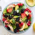 A clear bowl packed with a healthy Whole30 Chicken Blackberry Salad.