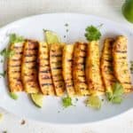 A platter of sweet and spicy grilled pineapple ready to serve.