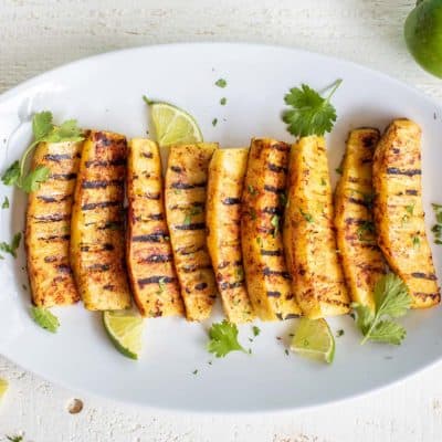 A platter of sweet and spicy grilled pineapple ready to serve.