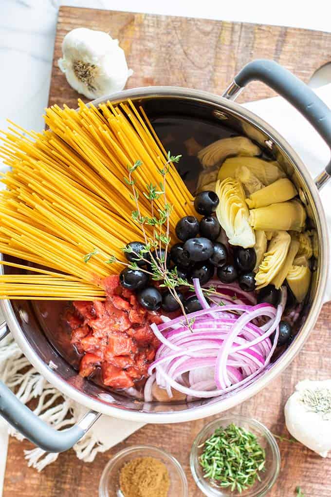 A pot filled with all the ingredients for this one pot pasta dish.
