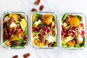 Colorful zoodle salads layered with golden beets, carrots, pomegranate and pecans.