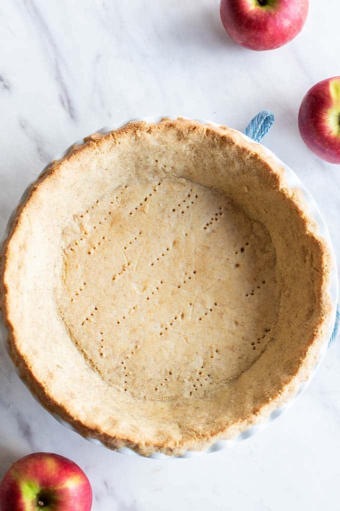 A baked gluten free pie crust ready to be filled.