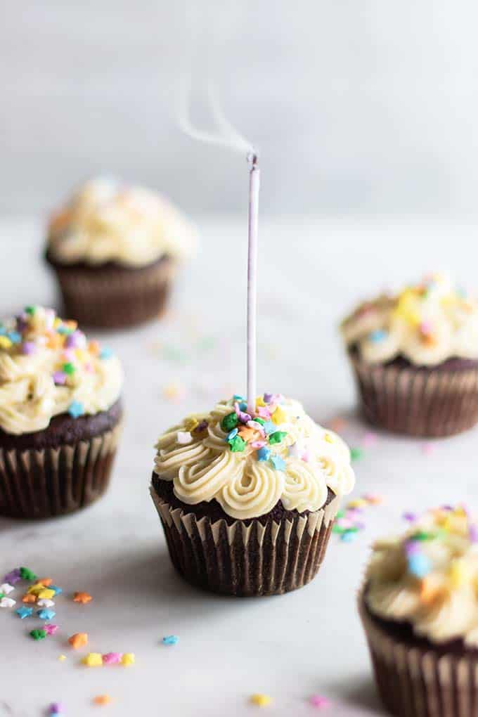Almond flour cupcakes with a candle being blown out.