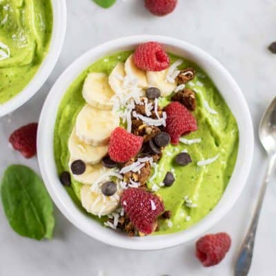 A close up look at a healthy vegan green smoothie bowl.