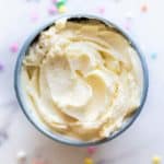 A bowl of white chocolate buttercream frosting.
