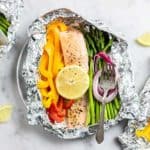 3 foil packets with baked salmon and veggies.