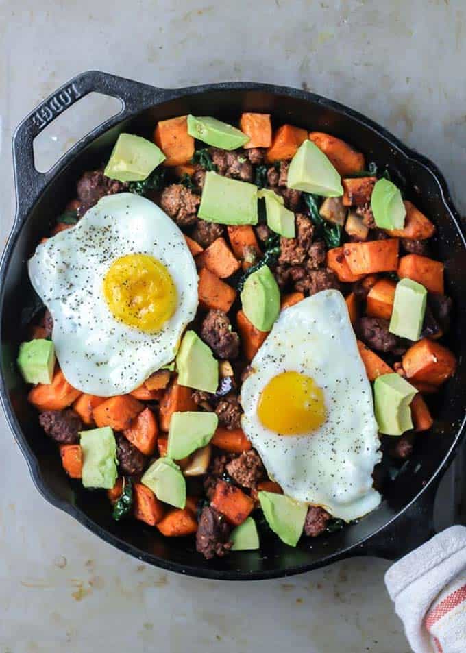 Sweet potato hash shown in a black cast iron skillet.