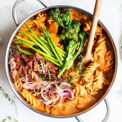 A creamy tomato one pot pasta made with sundried tomatoes and asparagus.