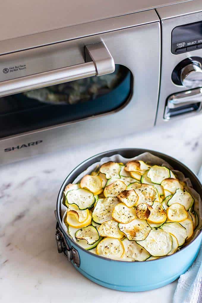 A whole baked zucchini pie in front of the Sharp Superheated Steam Countertop Oven.