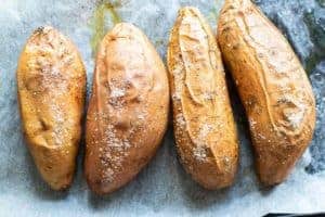 Baked wrinkly sweet potatoes covered in a light crunchy sprinkling of salt,.