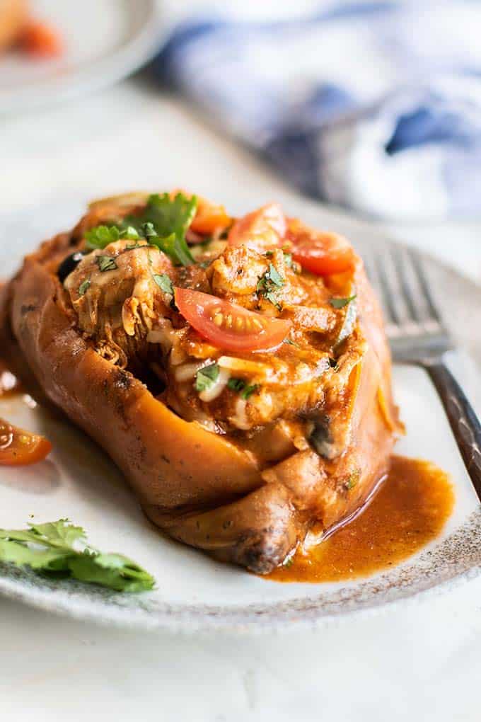 A slow roasted sweet potato filled with a chicken enchilada mixture.