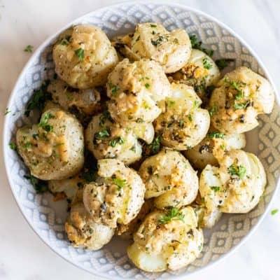 Crispy breakfast smashed potatoes in a serving bowl.