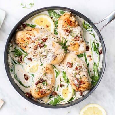 A pan of Whole30 Creamy Tuscan Garlic Chicken.