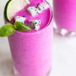 A close up of a dragon fruit smoothie garnished with white dragon fruit,