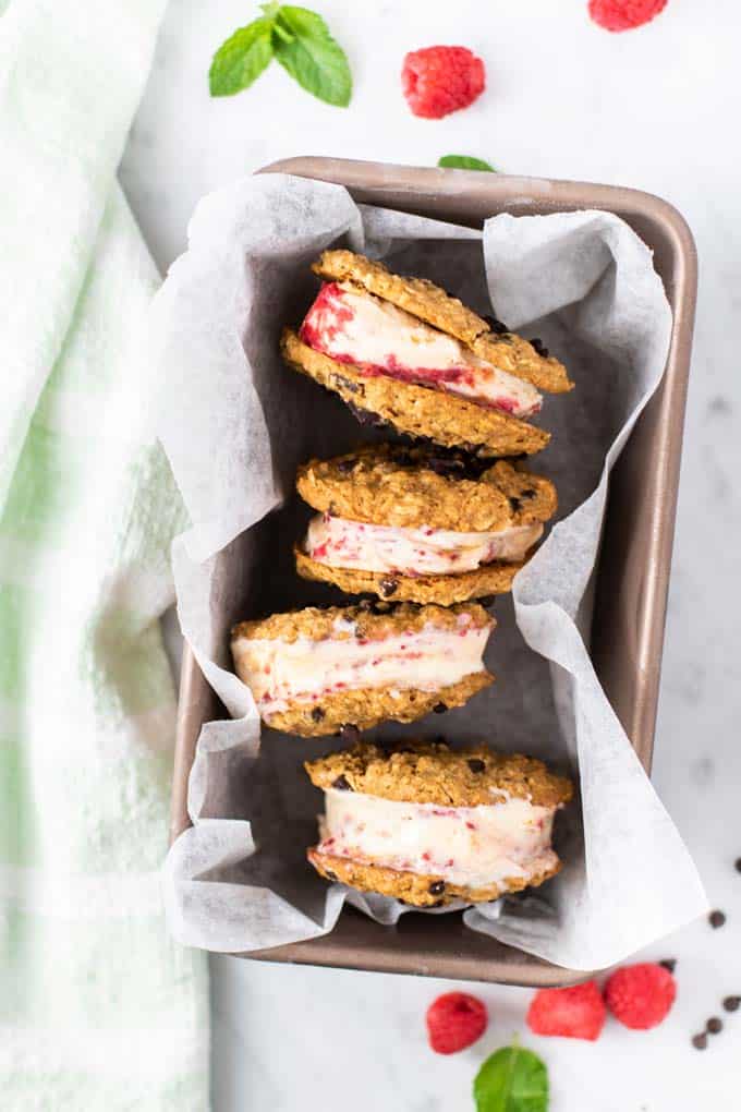 A tray with 4 raspberry swirl cookie ice cream sandwiches.