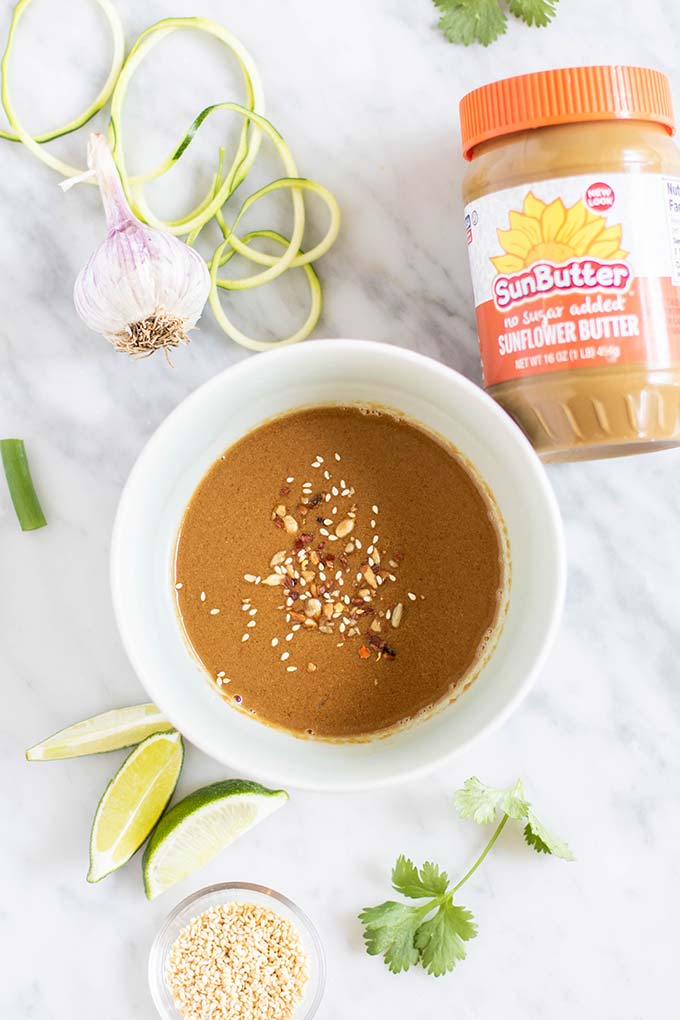 A bowl filled with a nutty sunflower seed butter sauce.