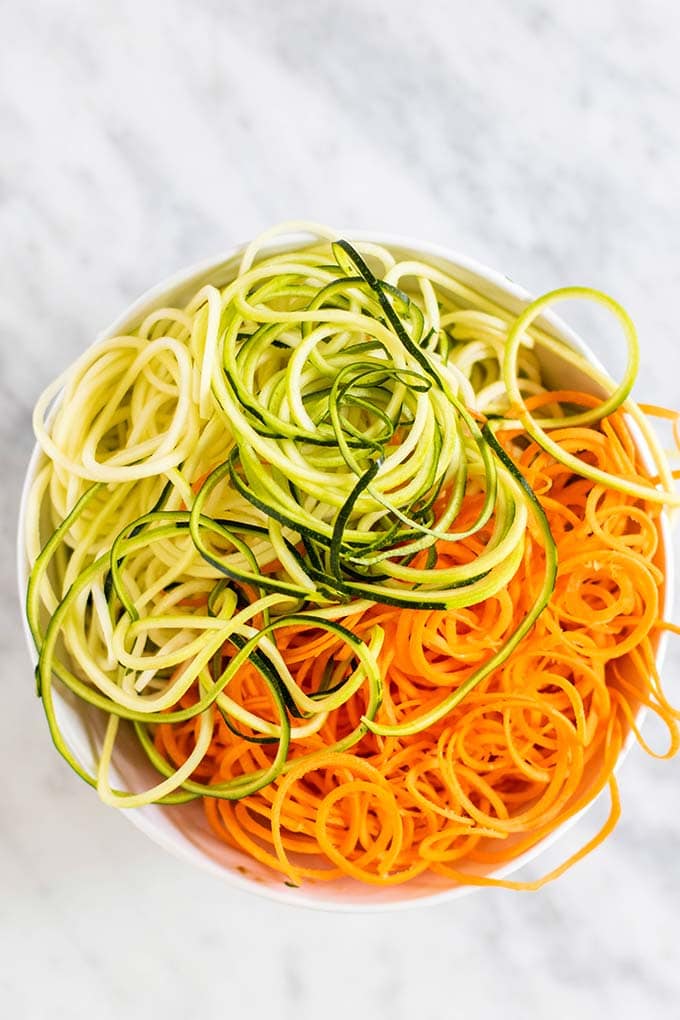 A bowl filled with zucchini and carrot noodles.