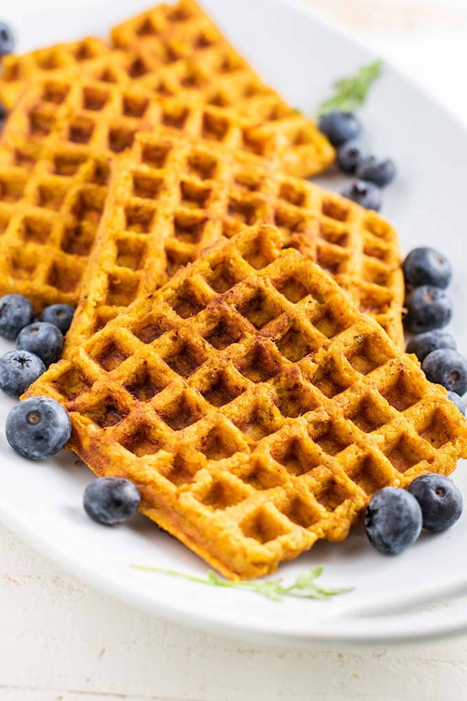 A plate showing a front view of a plate of sweet potato waffles.