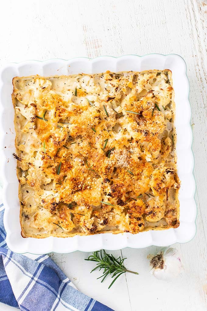 Cauliflower in a cheese sauce topped with breadcrumbs and rosemary.