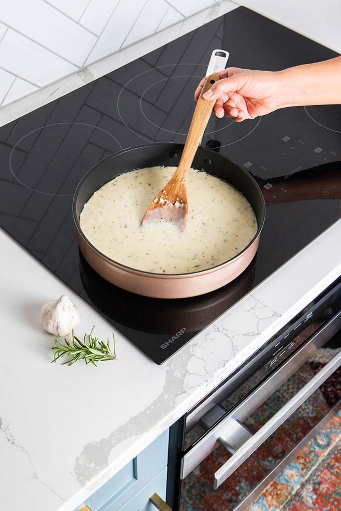 Cheese sauce being stirred on a Sharp Induction Cooktop.