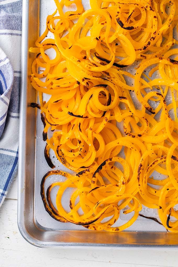 A baking pan with butternut squash noodles after they've been baked.