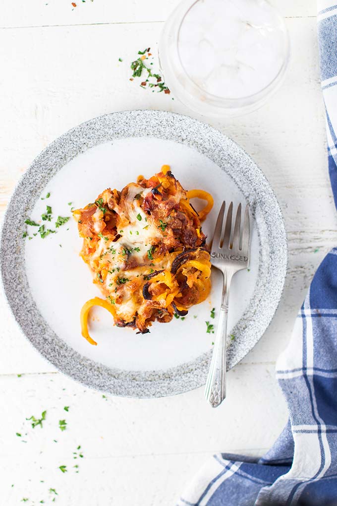 A slice of butternut baked spaghetti on a plate.