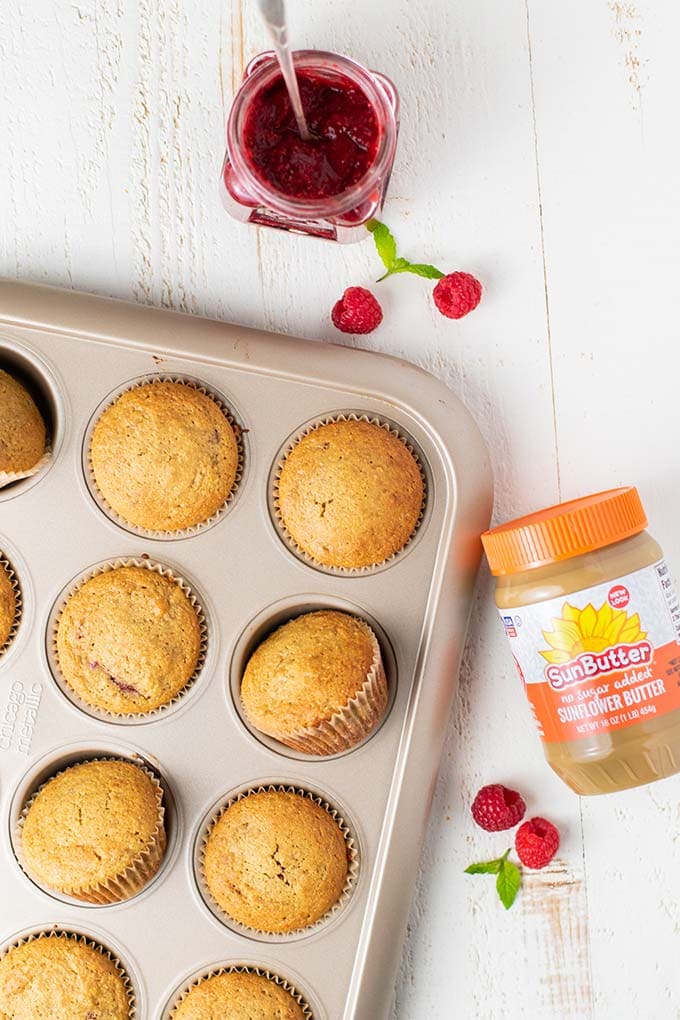 A muffin tin with muffins cooling.